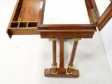 a wooden desk with a mirror on top of it