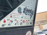 a close up of a parking meter with a lot of stickers on it