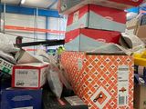 many boxes on a shelf in a warehouse