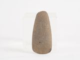 a stone object that is sitting on a white surface