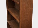 an image of a tall wooden bookcase