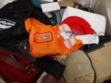 a pile of luggage sitting on top of a bed