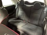 the back seats of a car are black with red trims