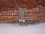 a close up of a metal latch on a wooden box