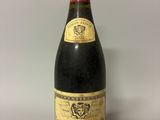 a close up of a bottle of wine sitting on a table