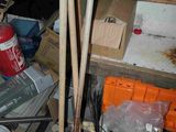 a pile of assorted items on a shelf in a room