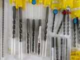 many different types of drill bits in a box