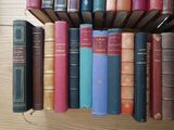 a lot of books that are sitting on a shelf