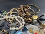 many different types of jewelry on the table