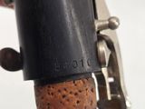 a close up of a person ' s hand holding a wine bottle