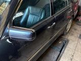 a picture of a black car parked in a garage