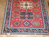 a rug on the floor with a cat sitting on top of it