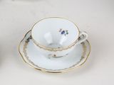 two cups and saucers sitting on a table