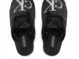 black slippers with white letters and a monogram on the side