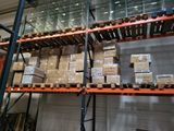 a large rack with boxes on it in a warehouse