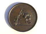 a coin with a bird on it on a white surface