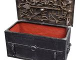 a black chest with a red lining inside of it