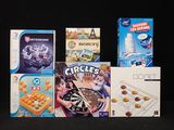 a lot of games on the table with a black background