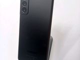 the back of a black phone with a camera on top of it