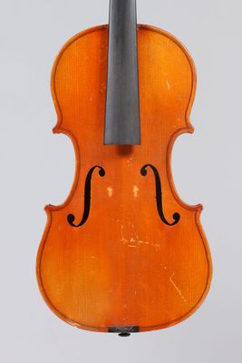 an orange violin with a black bow on a white background