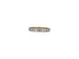 a white gold ring with five diamonds on a white background