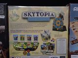 two games are shown on a black surface, one is a skytopia and the other is a skytopia board game