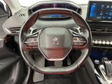 the interior of a car with a steering wheel and dashboard controls