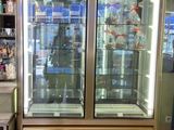 a large display case with two glass doors in a store