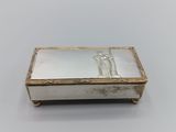 a silver box with a picture of a man and a woman on it