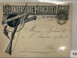 une vieille carte postale sur laquelle figure l'image d'un pistolet