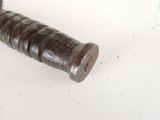 a close up of a baseball bat on a white surface