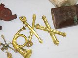 a lot of brass items that are on a table