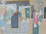 a painting on the wall of a building with people on it