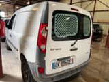 a white van that is parked in a garage