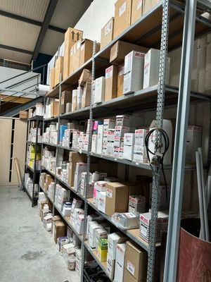 many boxes on the shelves in the warehouse