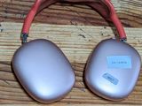 an image of a pair of headphones sitting on top of a wooden floor