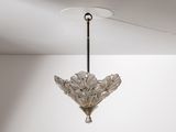 a glass chandelier hanging from the ceiling in a room