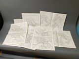 six cartes du monde disposées sur une chaise