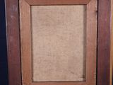 an old wooden easel with a painting on top of it on a blue background