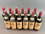 six bottles of red wine are lined up in a row