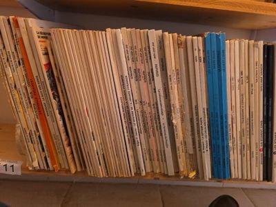 a book shelf with a bunch of books on top of it
