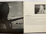an open book with a picture of a man on a plane