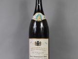 an image of a bottle of wine sitting on top of a table