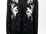 a black jacket with gold and silver sequins on it