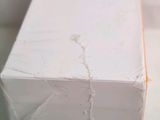 a close up of a piece of white paper on a table