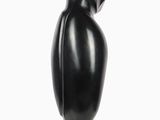 sculpture of a black bird on a black base on a white background