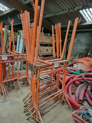 a large pile of pipes and pipes in a building