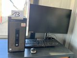 a desktop computer sitting on a desk next to a monitor and keyboard