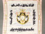 a pink and white scarf with a picture of a horse drawn carriage