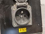 a close up of a metal box with a clock on it